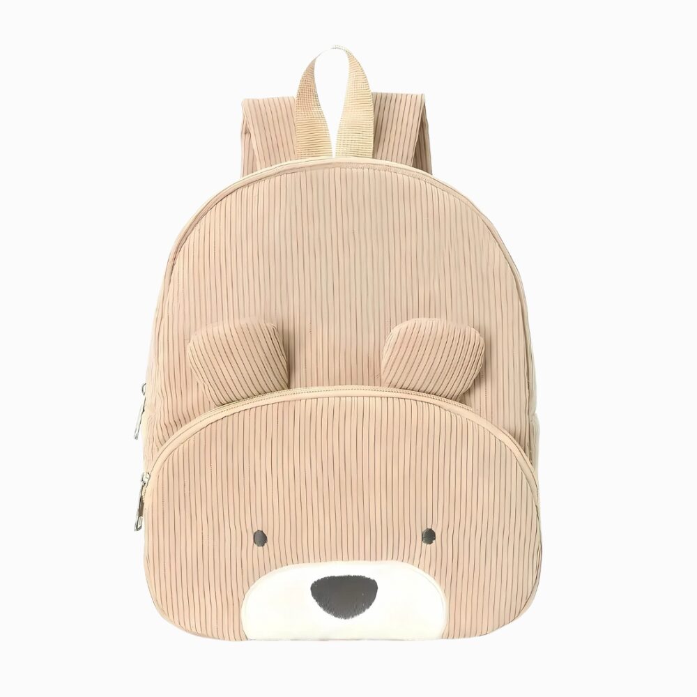 Cartable grande section en velours côtelé beige avec une tête d'ourson sur la poche avant. Sur fond gris clair.