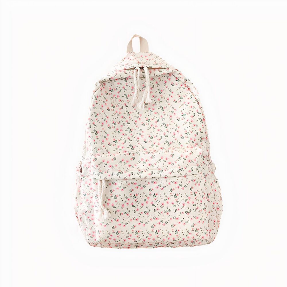 cartable blanc avec imprimé floral rose, ambiance douce et vintage, sur fond blanc