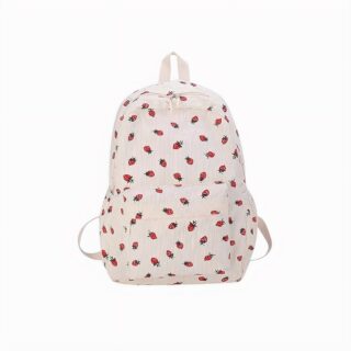 cartable beige en velours côtelé avec motifs fraises rouges, vue de face, sur fond neutre.