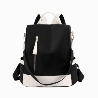 Cartable sac à main avec bretelles et bandoulière de couleur noir avec le bas du sac blanc. Une fermeture zippée verticale sur le devant avec des détails dorés. Sur fons gris clair.