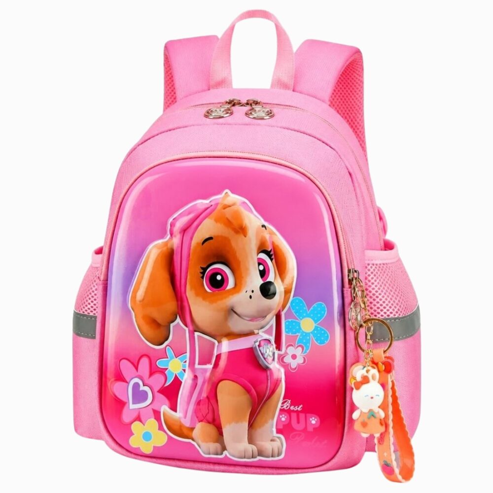 Un cartable Pat'Patrouille Stella pour maternelle rose, avec la petite chienne Stella sur le devant et un porte-clés suspendu, posé sur fond blanc.
